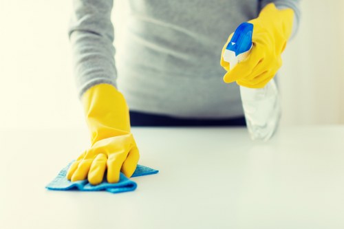 Local cleaners carrying out washroom and touchpoint cleaning in Kensington