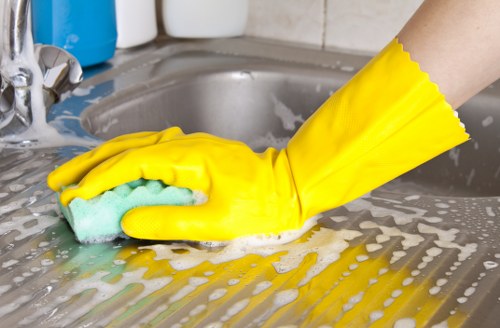 Local sofa cleaner treating a lounge sofa in Kensington