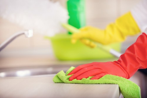 Professional cleaner maintaining a safe and organised cleaning environment