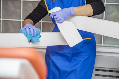Cleaner Kensington team member using protective equipment during a safe cleaning service